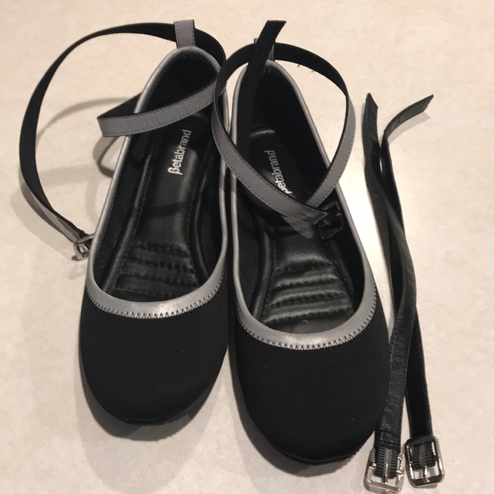 Black flats with reflective silver accent
